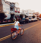 woman riding a bike with a Pennypack bike crate